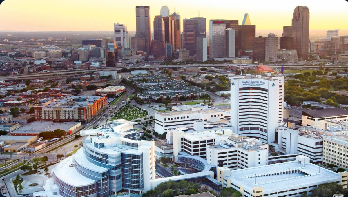Baylor University Medical Center campus with the downtown Dallas skyline at sunset